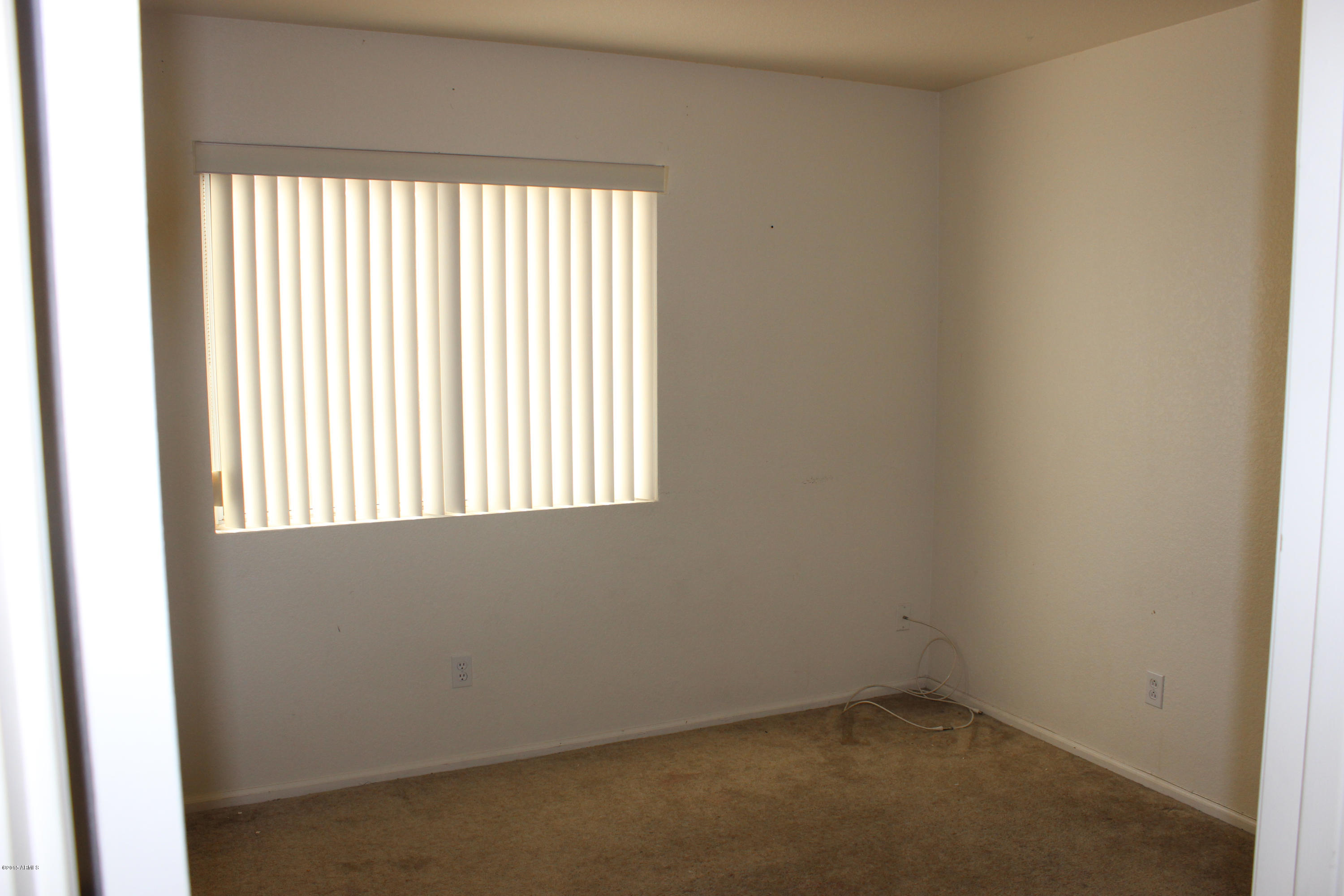 5028 Casper Road Mesa, AZ 85205 - Photo 18 of 33 an empty room with a window