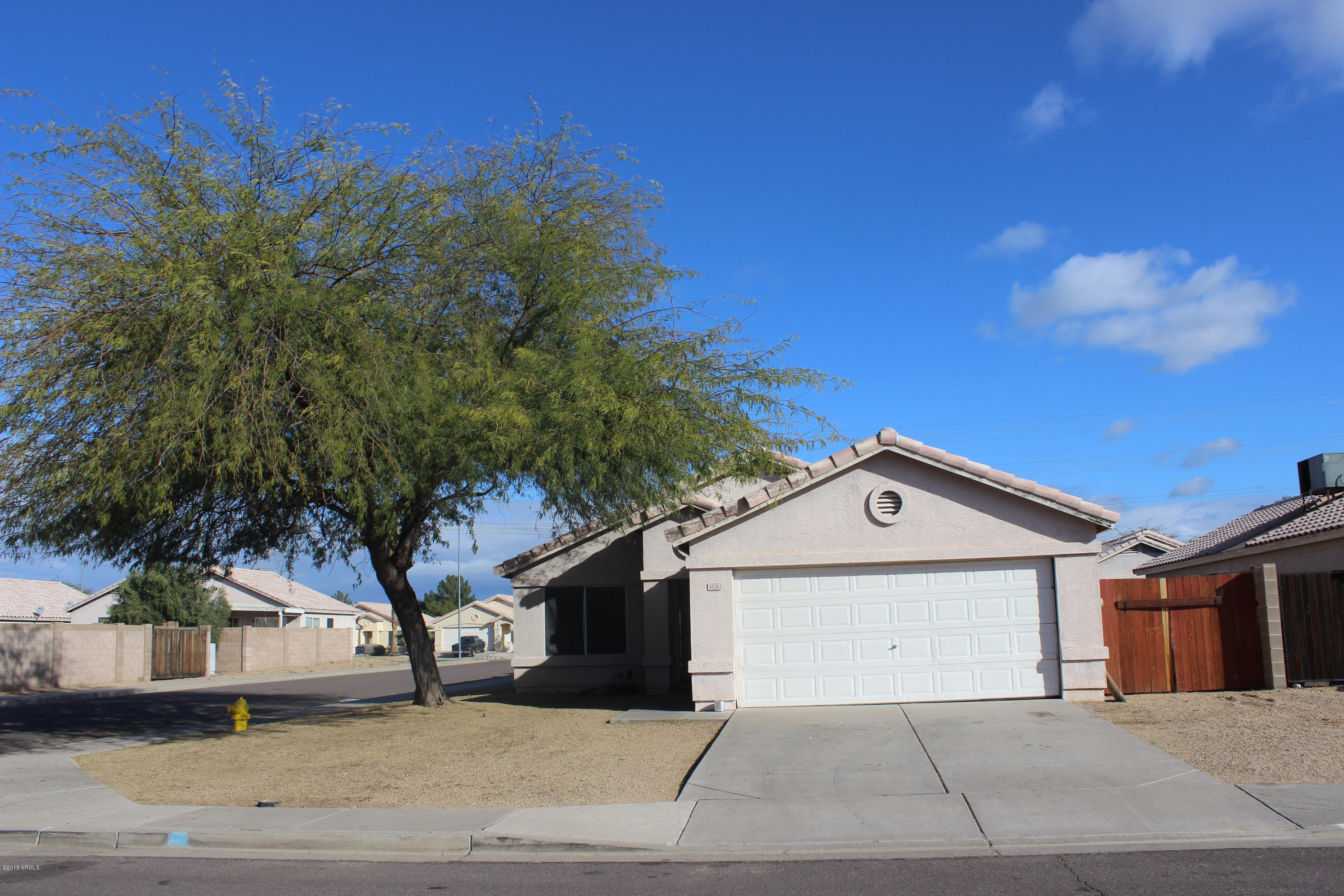 5028 Casper Road Mesa, AZ 85205 - Photo 2 of 33 a view of garage with a tree