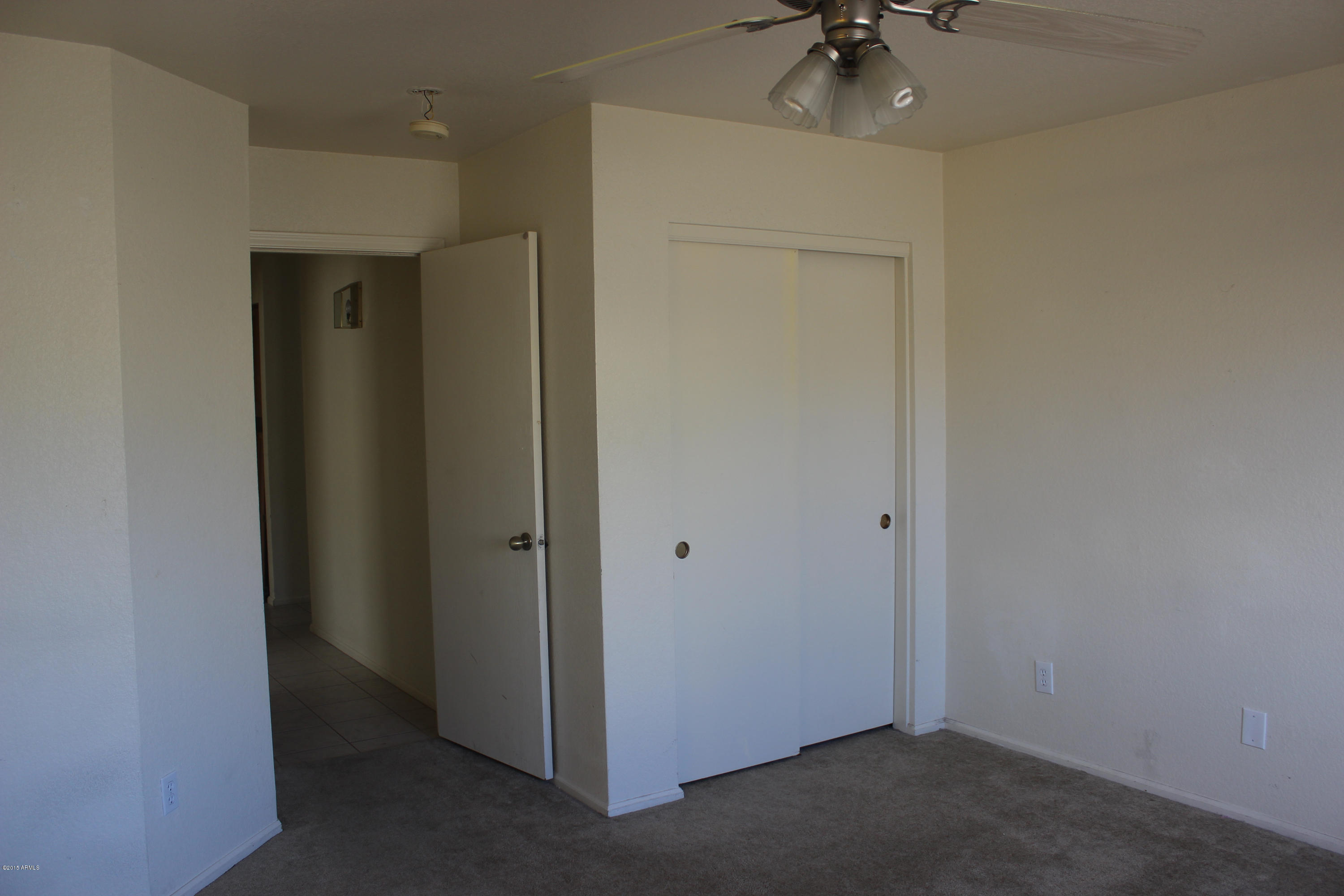 5028 Casper Road Mesa, AZ 85205 - Photo 21 of 33 an empty room to ceiling fan and a window