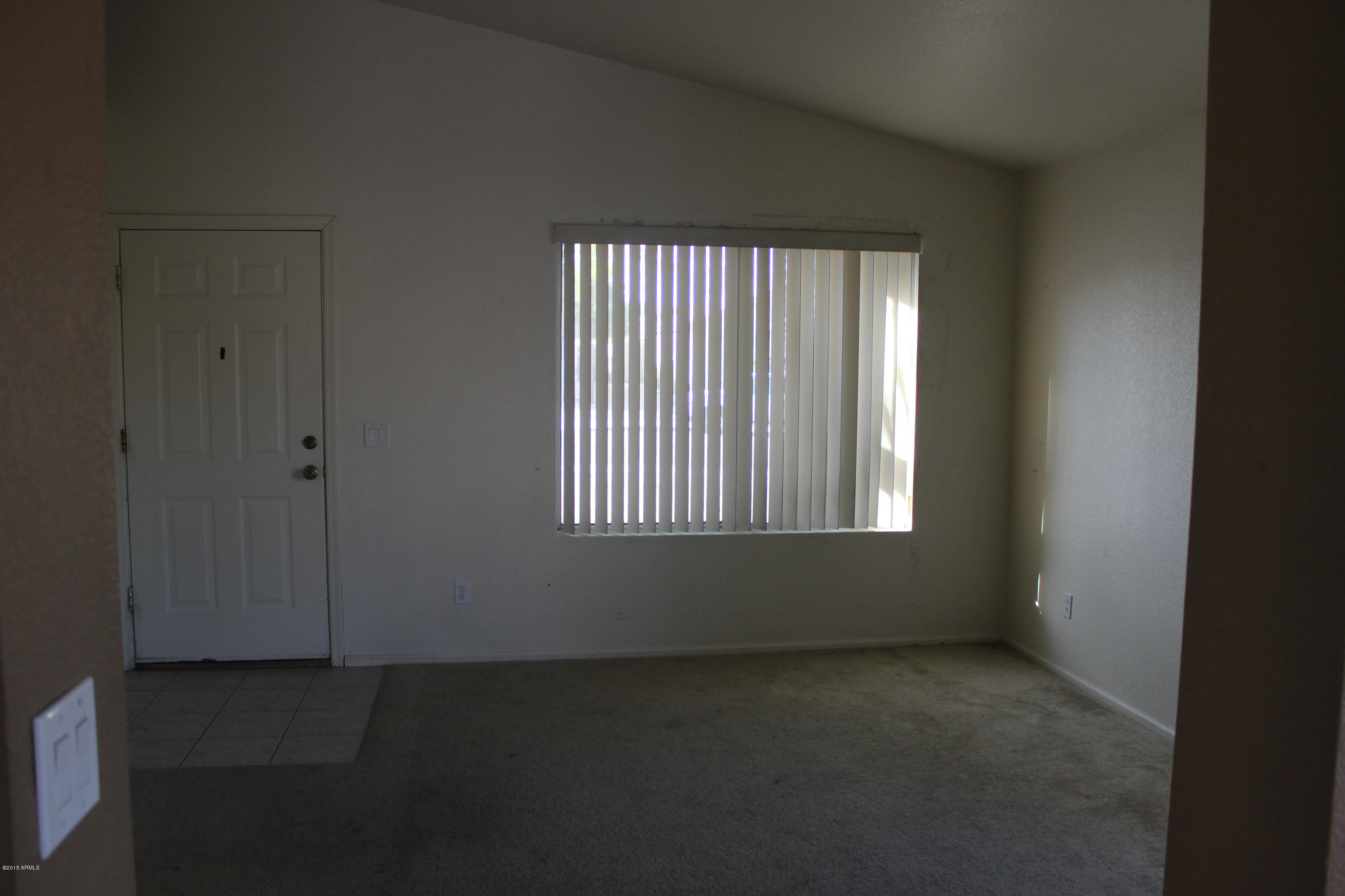 5028 Casper Road Mesa, AZ 85205 - Photo 5 of 33 an empty room with a window