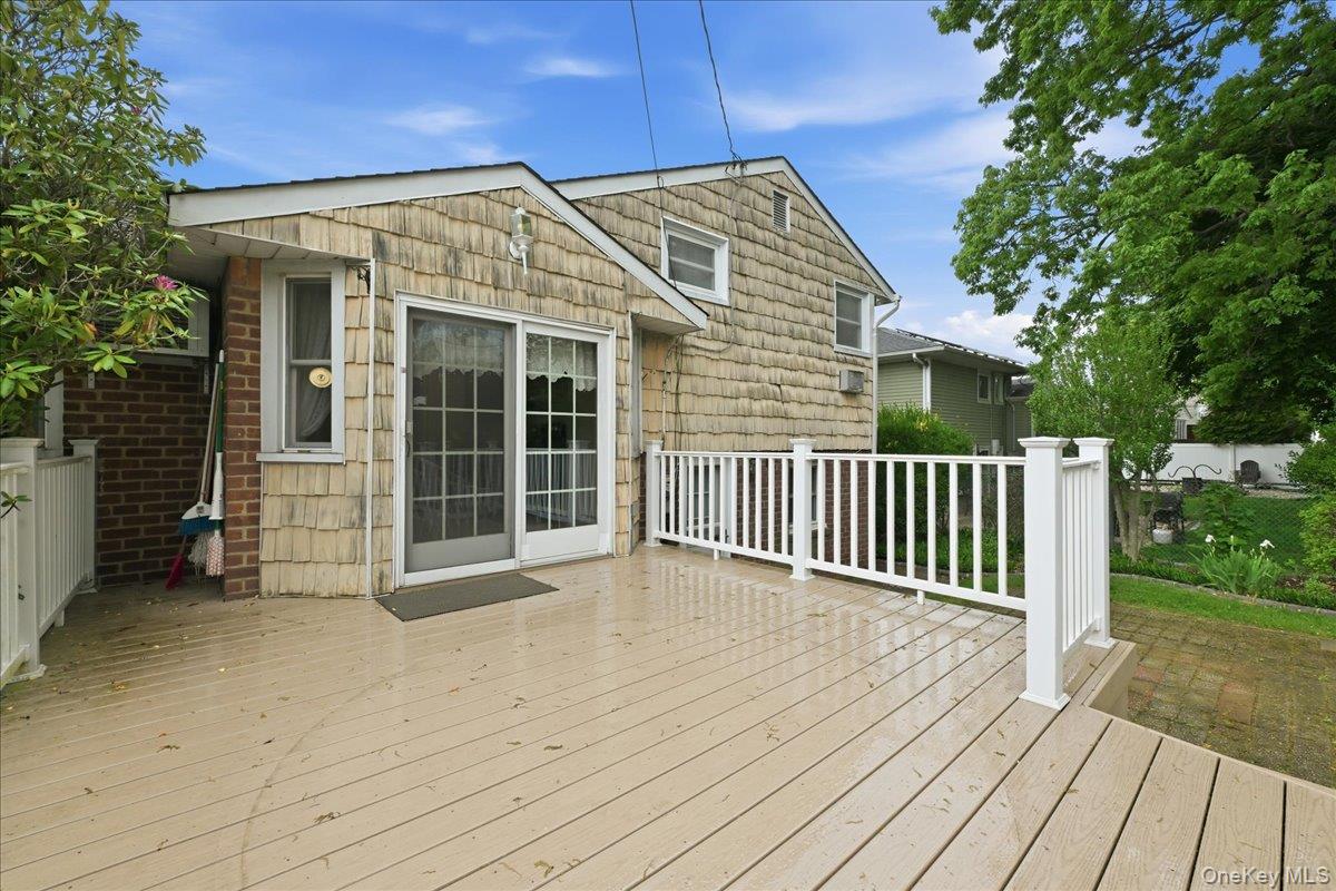 17 Avon Road Farmingdale, NY 11735 - Photo 35 of 46 a view of a house with wooden deck