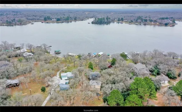 an aerial view of house with yard
