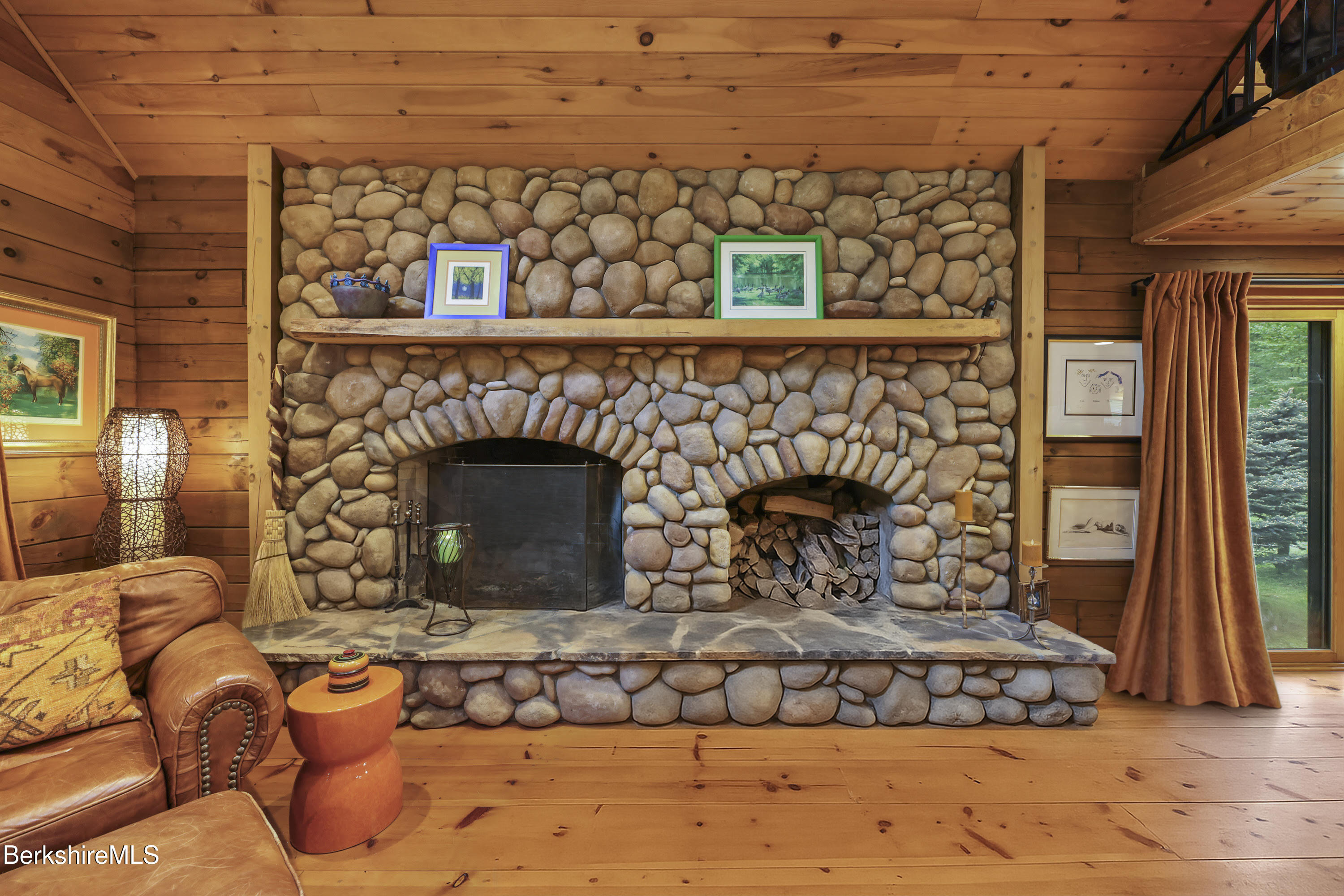 236 Surriner Road Becket, MA 01223 - Photo 20 of 45 a living room with a fireplace
