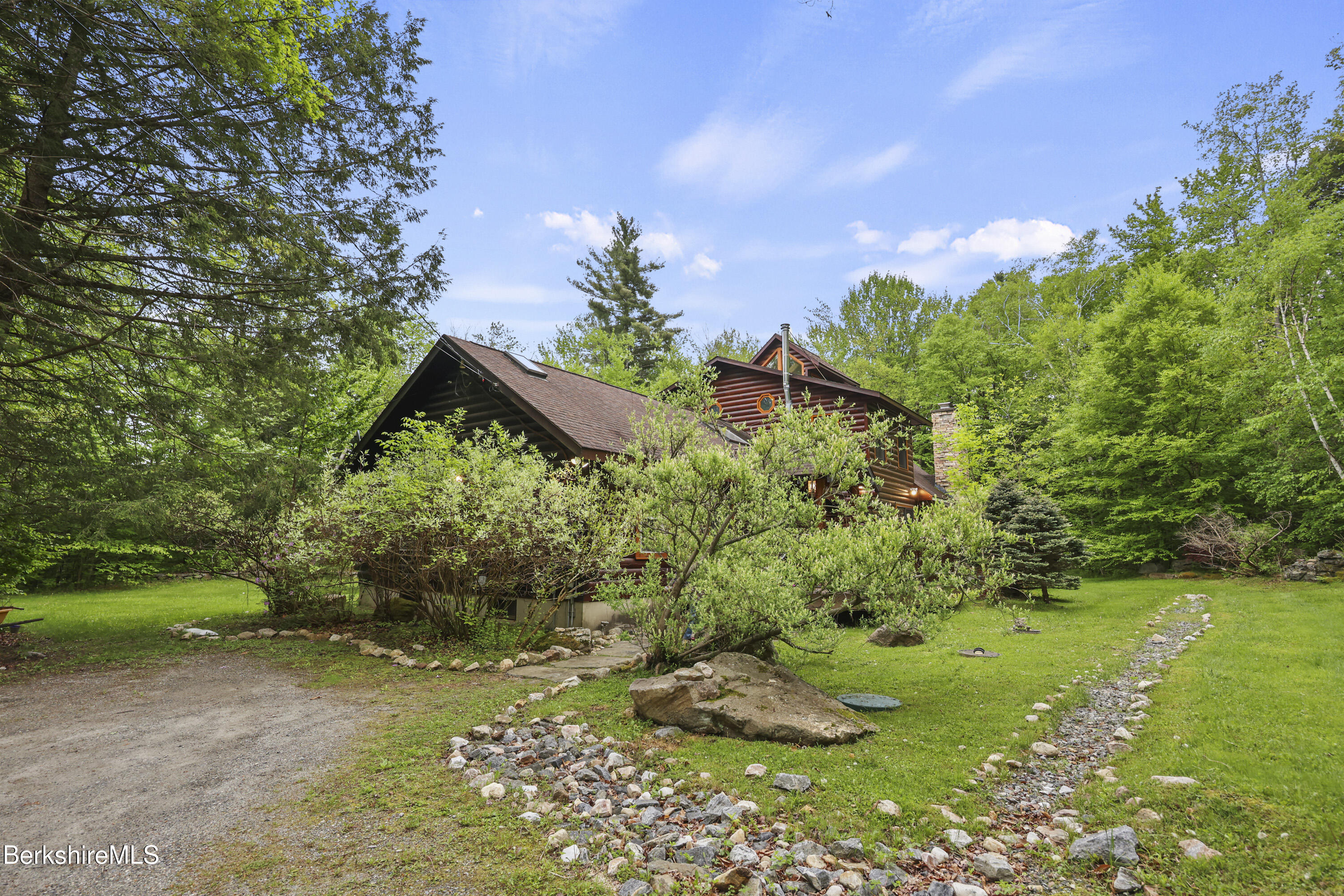 236 Surriner Road Becket, MA 01223 - Photo 3 of 45 a backyard of a house with lots of green space