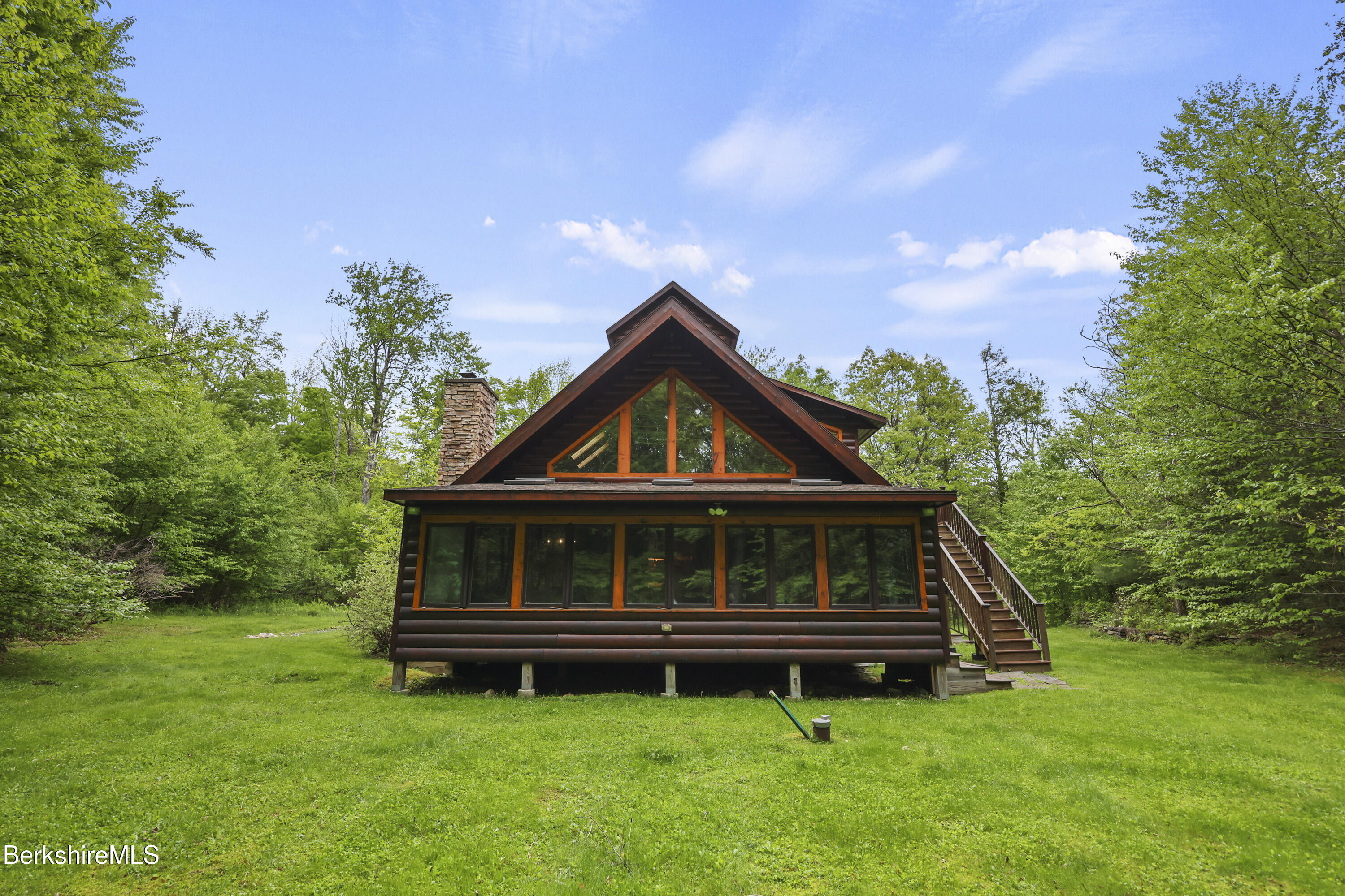 236 Surriner Road Becket, MA 01223 - Photo 40 of 45 a front view of a house with a garden