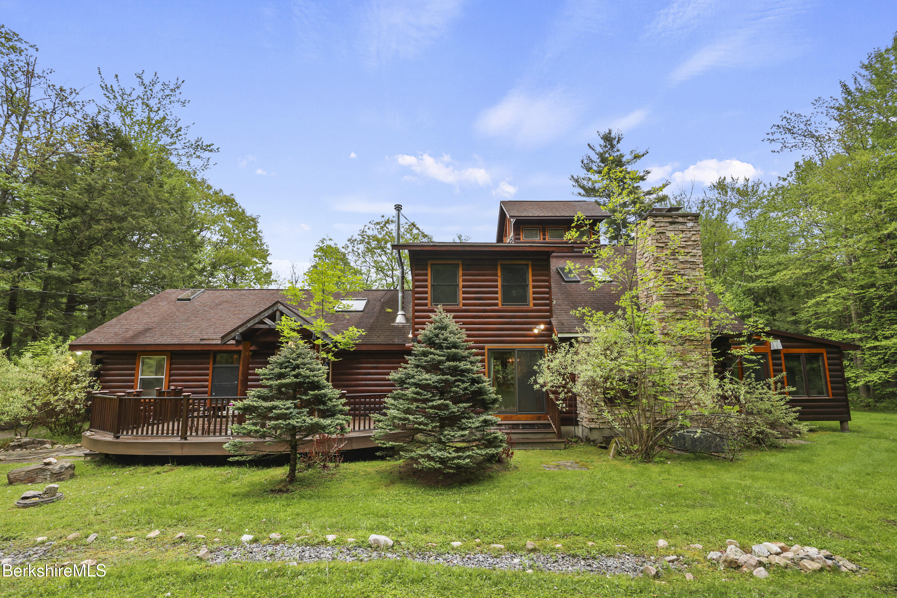 236 Surriner Road Becket, MA 01223 - Photo 4 of 45 a front view of a house with a garden
