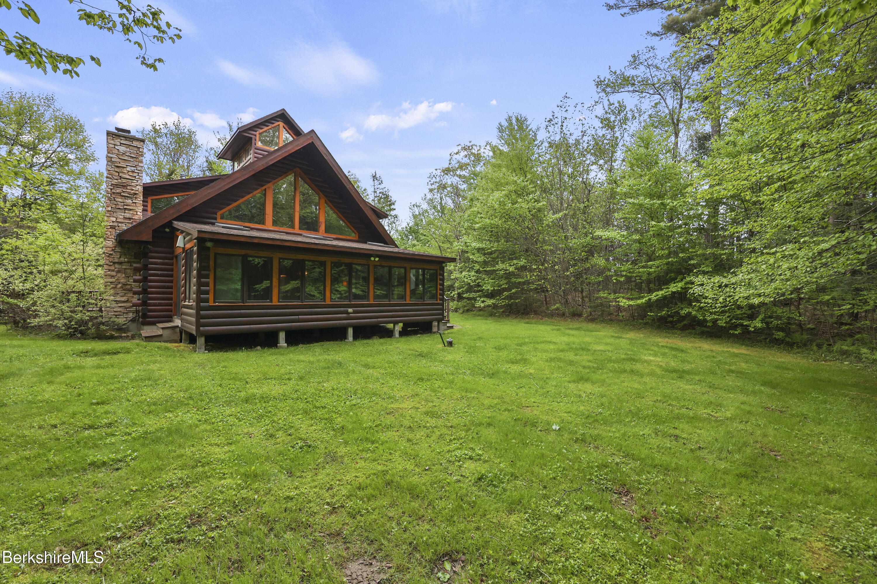 236 Surriner Road Becket, MA 01223 - Photo 41 of 45 a front view of a house with garden