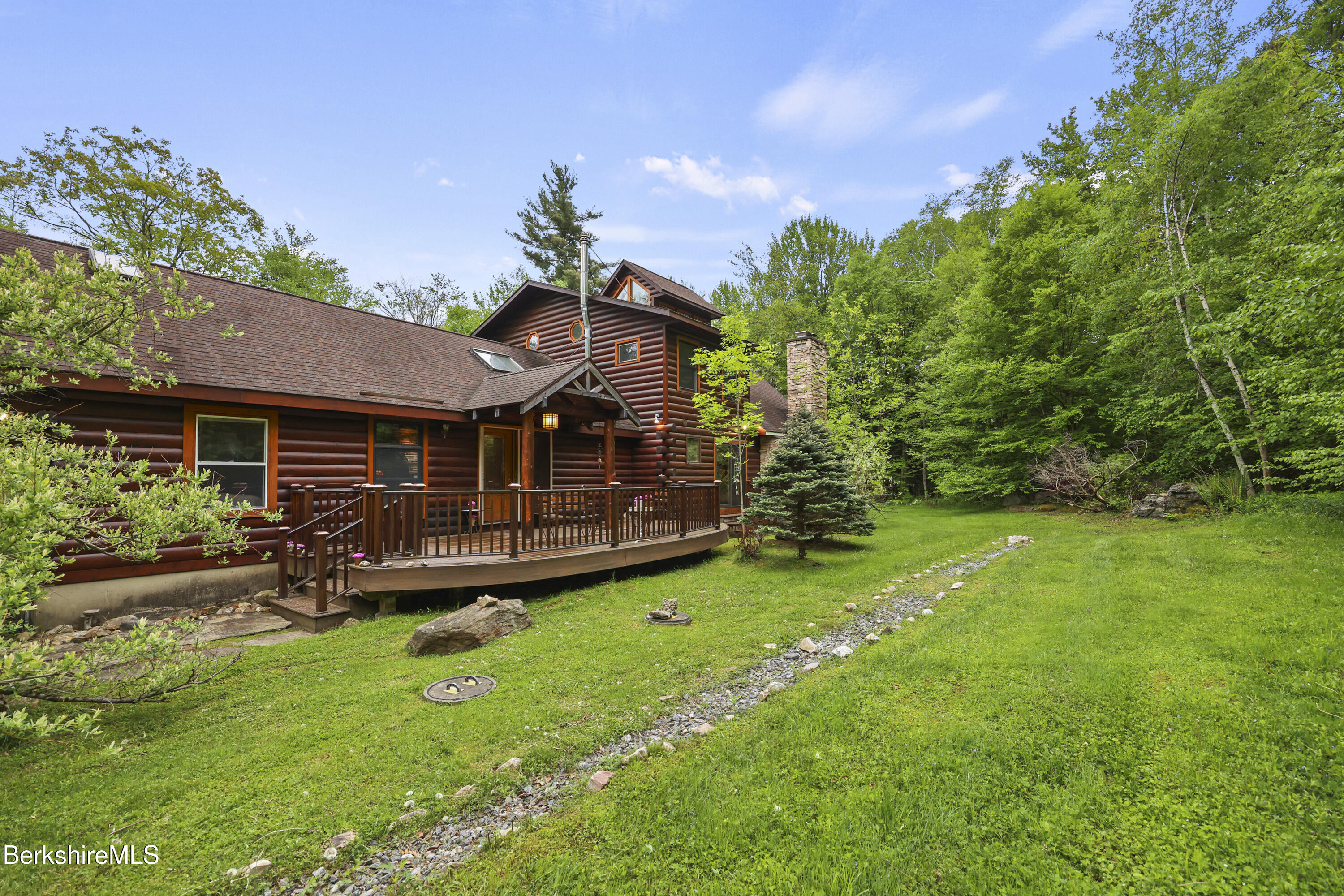 236 Surriner Road Becket, MA 01223 - Photo 5 of 45 a front view of a house with a yard