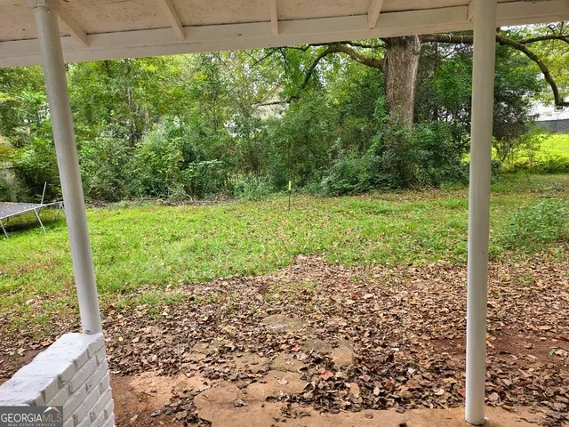 a view of a yard with a trees