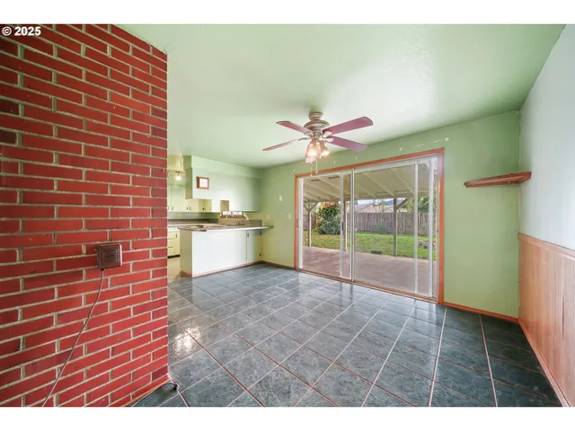 a view of an entryway and a kitchen