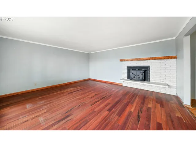 a room with a bed and a fireplace