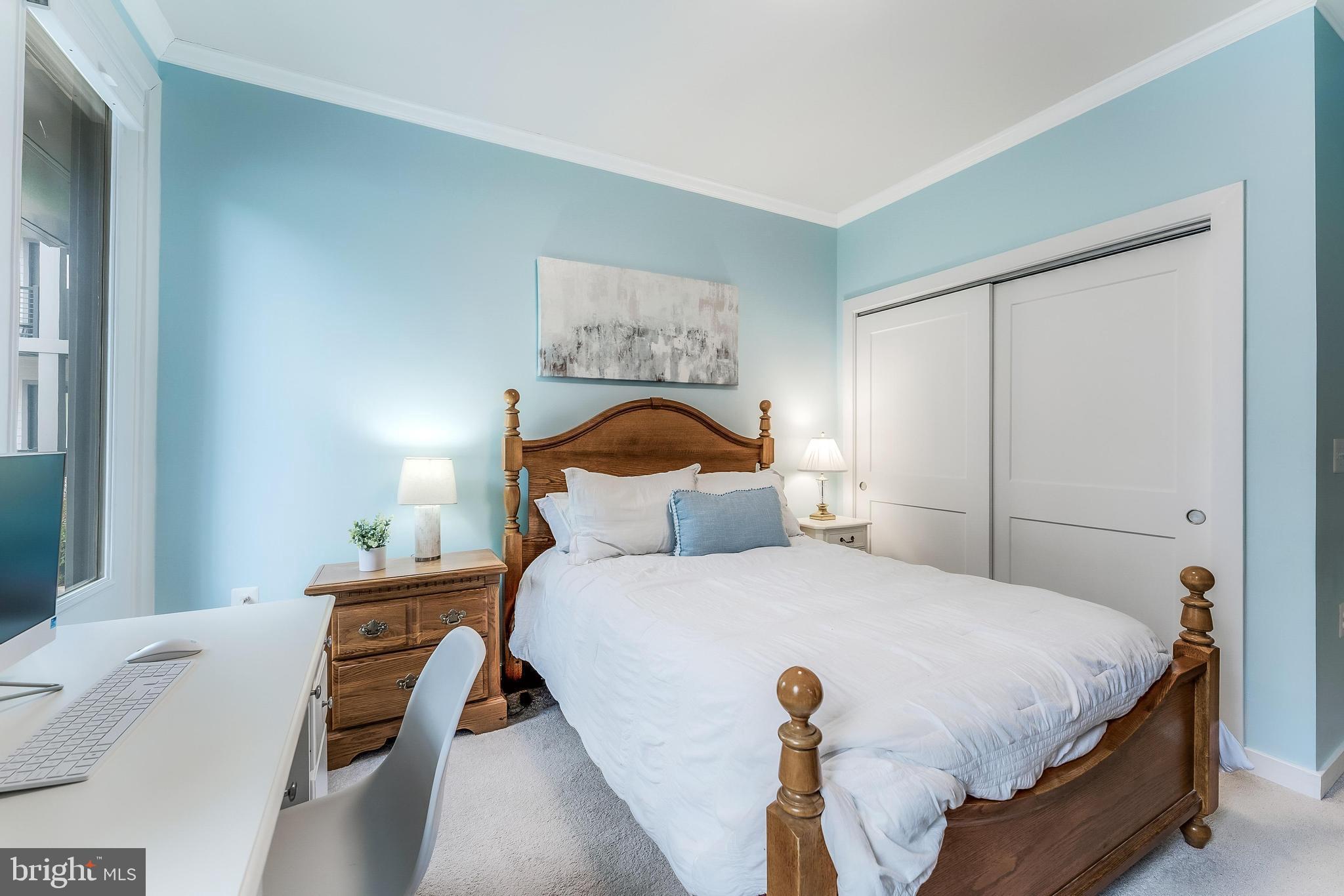 1675 Bandit Loop, Unit 105B Reston, VA 20190 - Photo 13 of 27 a bedroom with a bed and a window