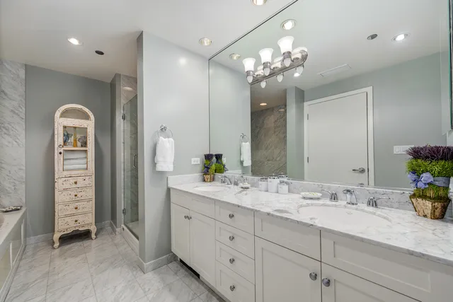 a view of a patio with dining table and chairs and potted plants