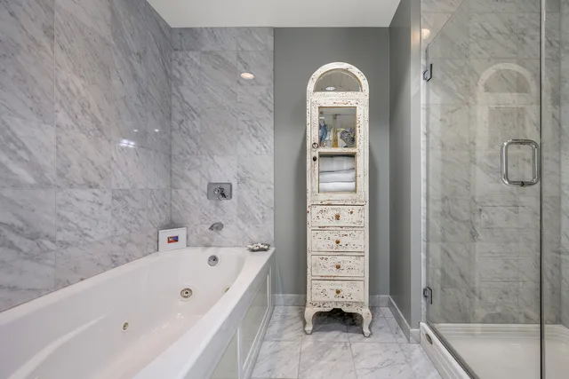 a view of a patio with dining table and chairs and potted plants