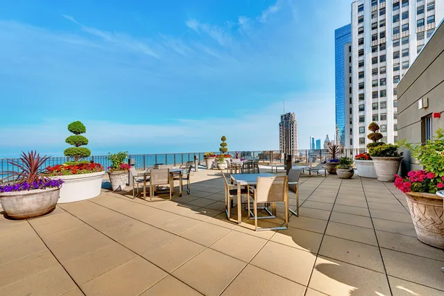 a living room with lots of furniture and a wooden floor
