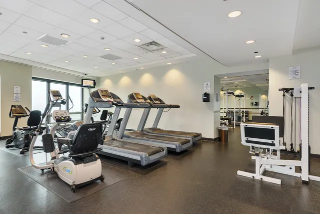 a picture of a bathroom with a sink and a refrigerator