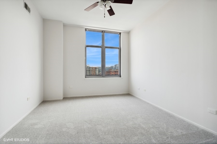1201 West Adams Street, Unit 701 Chicago, IL 60607 - Photo 14 of 29 an empty room with a window
