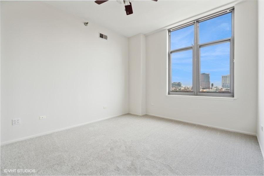 1201 West Adams Street, Unit 701 Chicago, IL 60607 - Photo 16 of 29 an empty room with a window