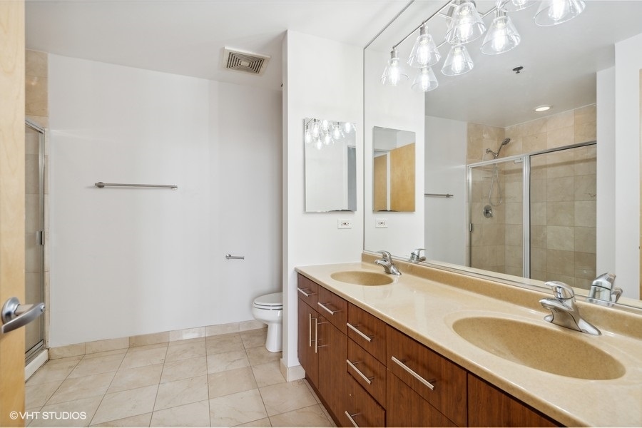 1201 West Adams Street, Unit 701 Chicago, IL 60607 - Photo 19 of 29 a bathroom with a double vanity sink mirror and double
