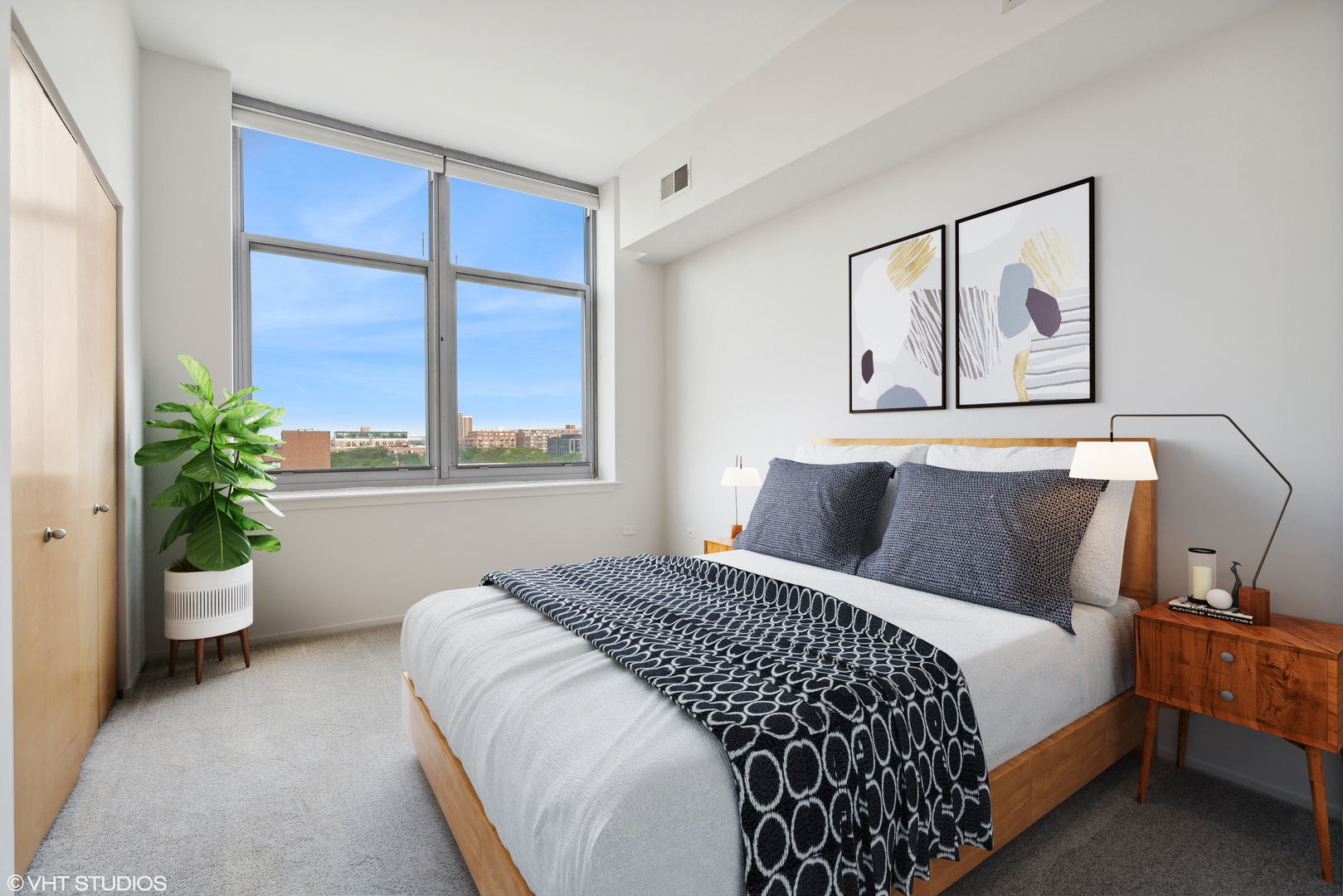 1201 West Adams Street, Unit 701 Chicago, IL 60607 - Photo 22 of 29 a bed sitting in a bedroom next to a window