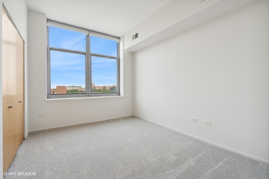 1201 West Adams Street, Unit 701 Chicago, IL 60607 - Photo 23 of 29 an empty room with a window