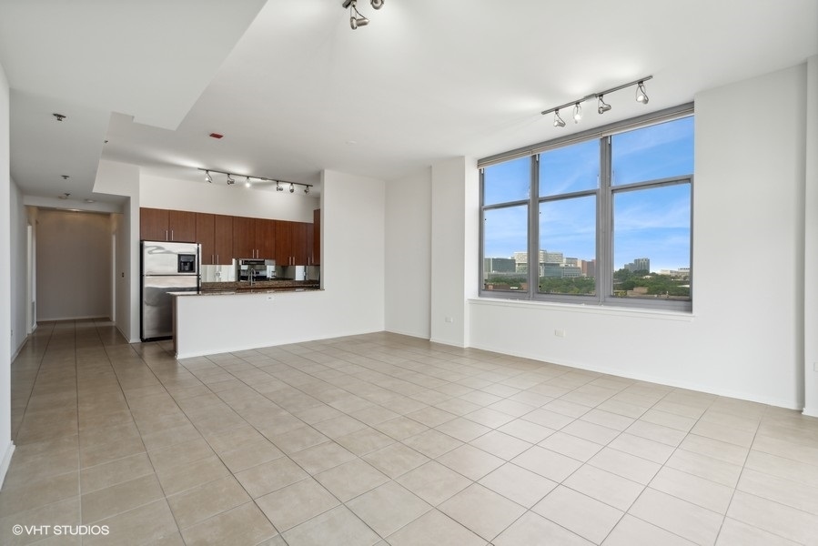 1201 West Adams Street, Unit 701 Chicago, IL 60607 - Photo 9 of 29 a view of a kitchen with a sink and a window