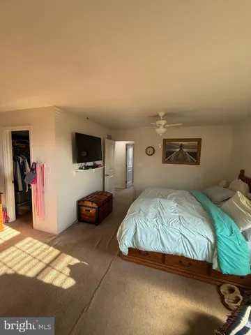 a bedroom with a bed and a view of bedroom