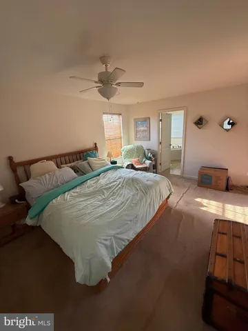 a bedroom with bed and window
