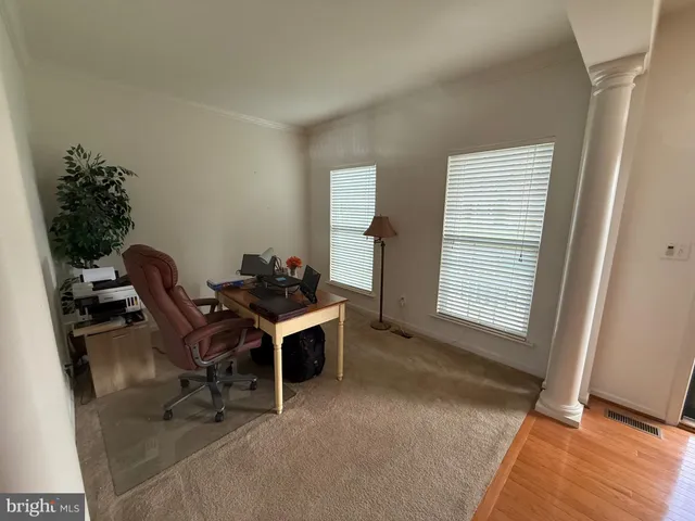 a workspace with furniture and a window