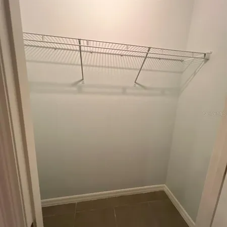 a view of a room with racks on the wall