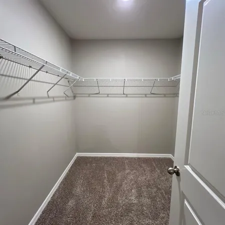 a view of a room with racks on the wall
