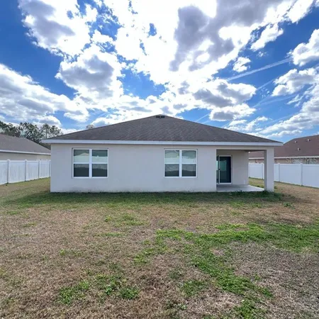 a view of a backyard with a garden