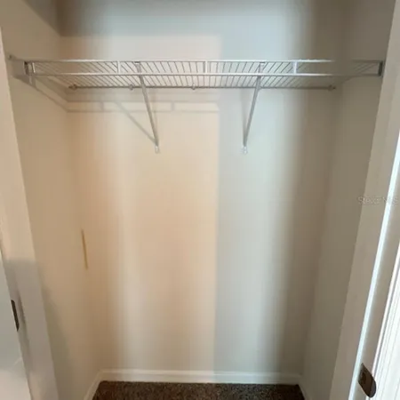 a view of a room with racks on the wall