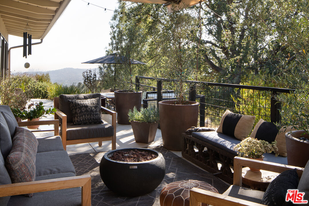 243 Taos Road Altadena, CA 91001 - Photo 7 of 32 a balcony with furniture and a potted plant