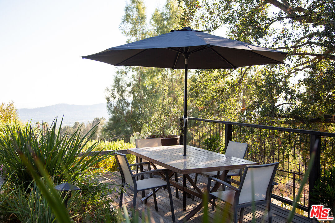 243 Taos Road Altadena, CA 91001 - Photo 8 of 32 a view of balcony with furniture and umbrella
