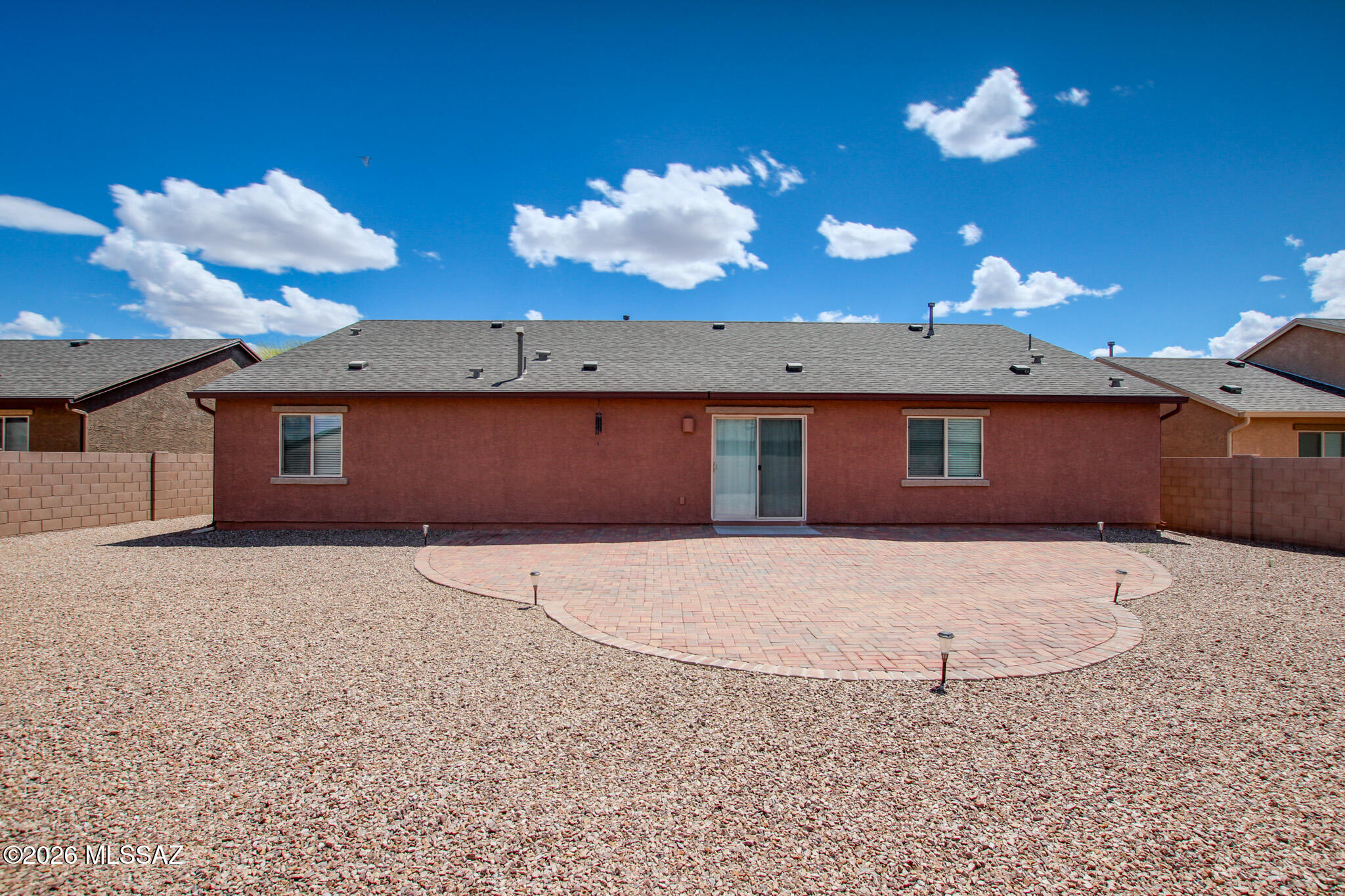 7056 South Draper Road Tucson, AZ 85757 - Photo 22 of 22 a view of a house with a yard