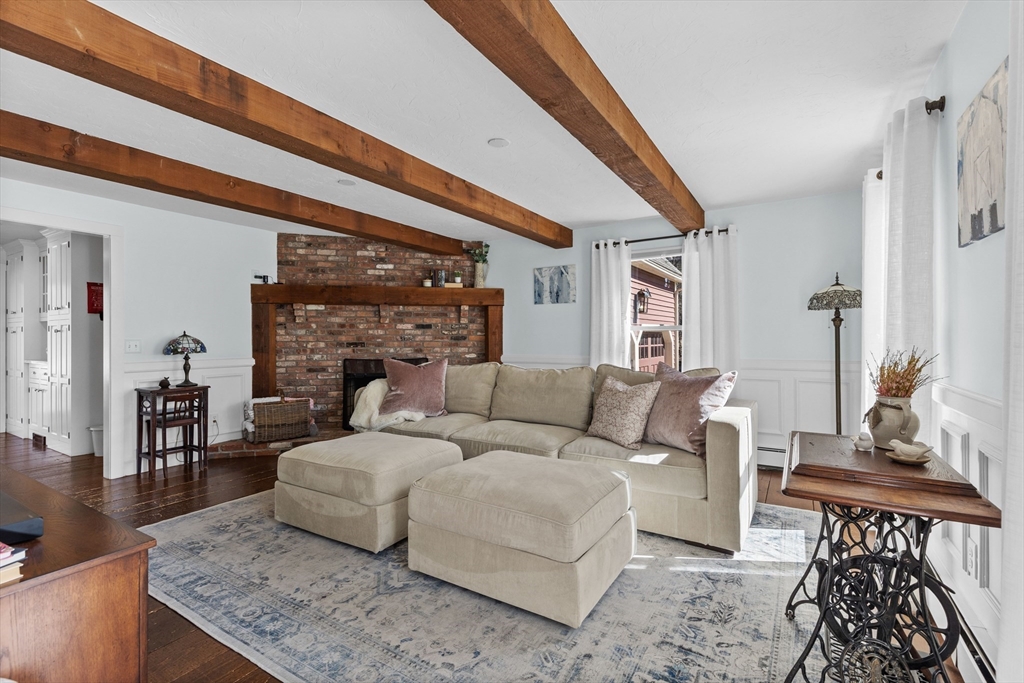 57 Whitewood Road Milford, MA 01757 - Photo 13 of 40 a living room with furniture and a fireplace