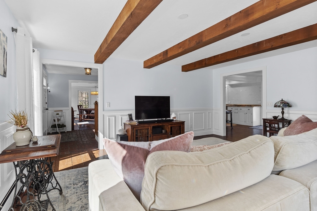 57 Whitewood Road Milford, MA 01757 - Photo 14 of 40 a living room with furniture and a flat screen tv