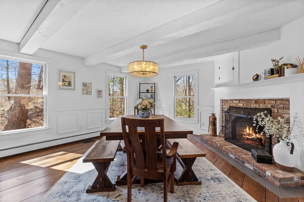 57 Whitewood Road Milford, MA 01757 - Photo 16 of 40 a living room with furniture and a fireplace
