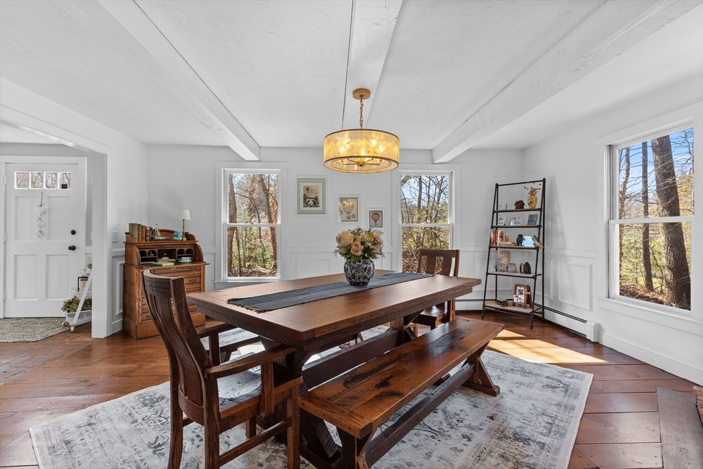 57 Whitewood Road Milford, MA 01757 - Photo 17 of 40 a living room with dining table and a window
