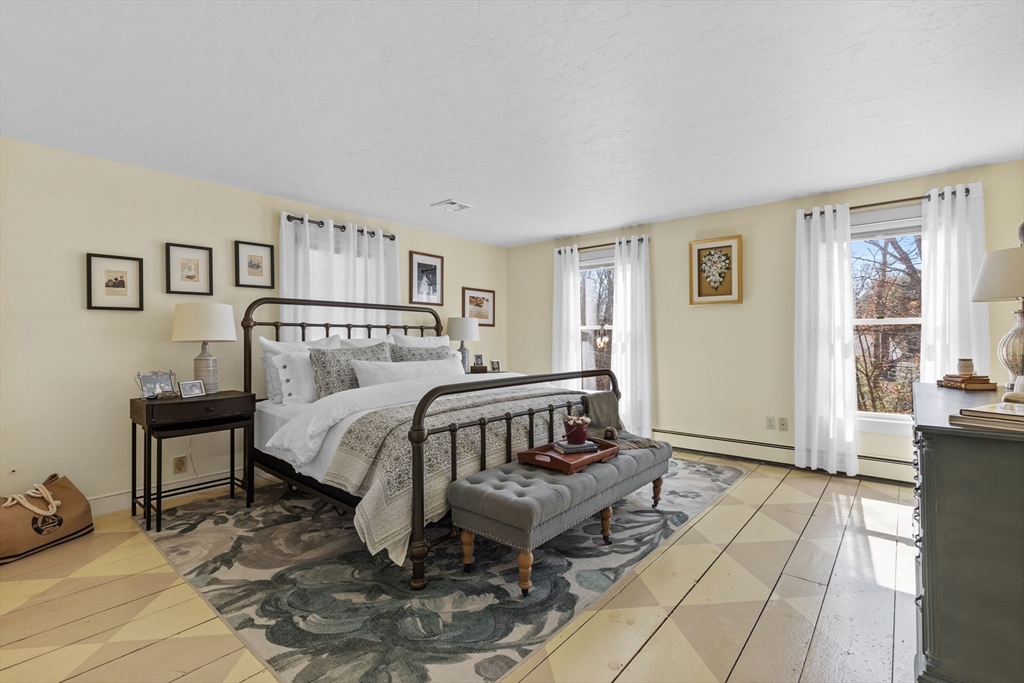 57 Whitewood Road Milford, MA 01757 - Photo 18 of 40 a bedroom with a bed and a tv