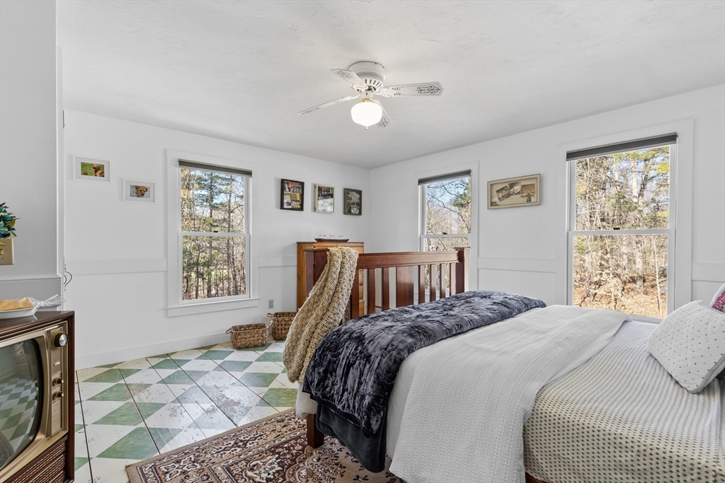 57 Whitewood Road Milford, MA 01757 - Photo 23 of 40 a bedroom with a large bed and a window