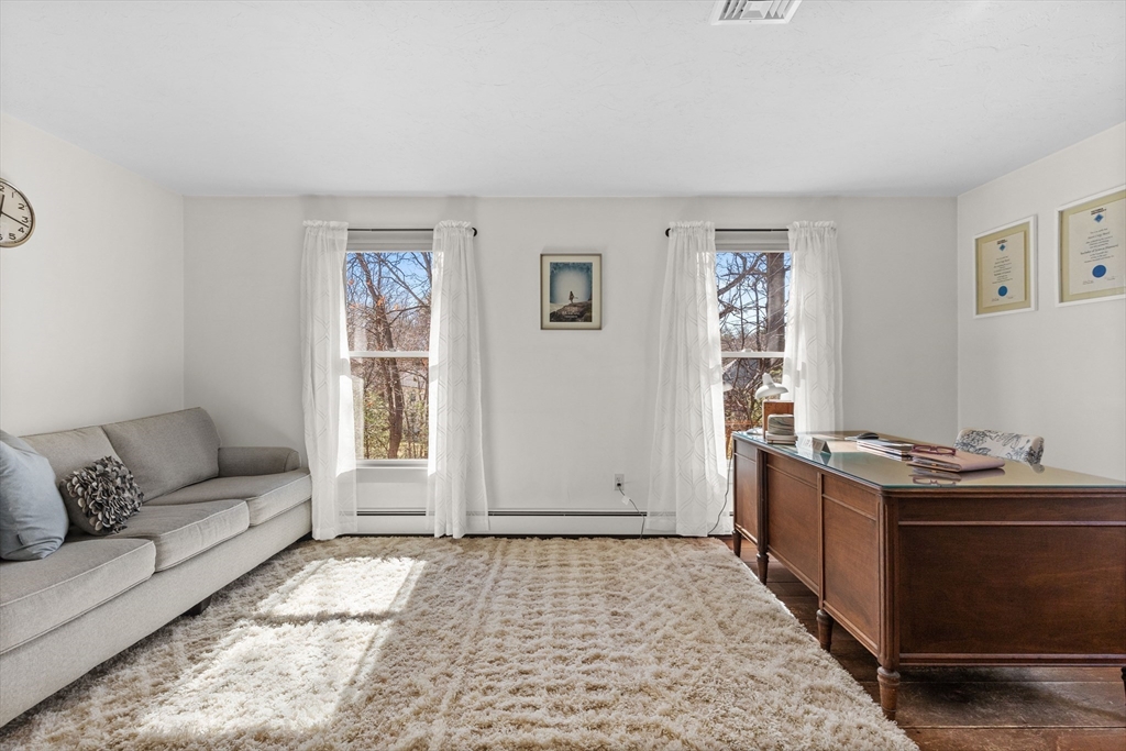 57 Whitewood Road Milford, MA 01757 - Photo 26 of 40 a living room with furniture and a window