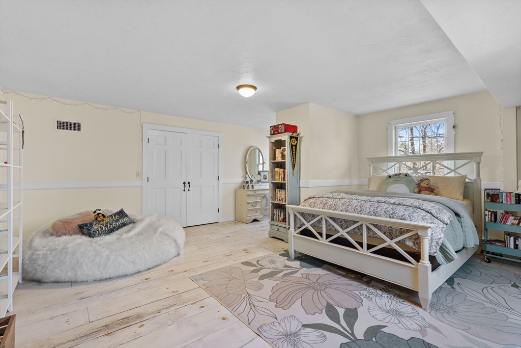 57 Whitewood Road Milford, MA 01757 - Photo 29 of 40 a bedroom with a bed and a window