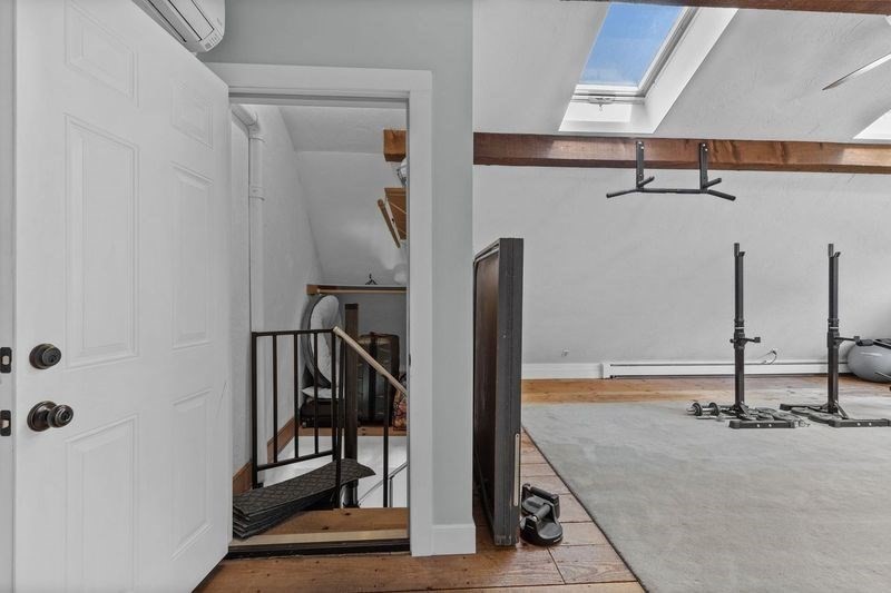 57 Whitewood Road Milford, MA 01757 - Photo 36 of 40 a view of a hallway with a white door and stairs