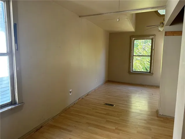 a view of an empty room and window