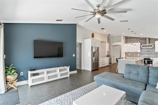 a living room with furniture and a flat screen tv