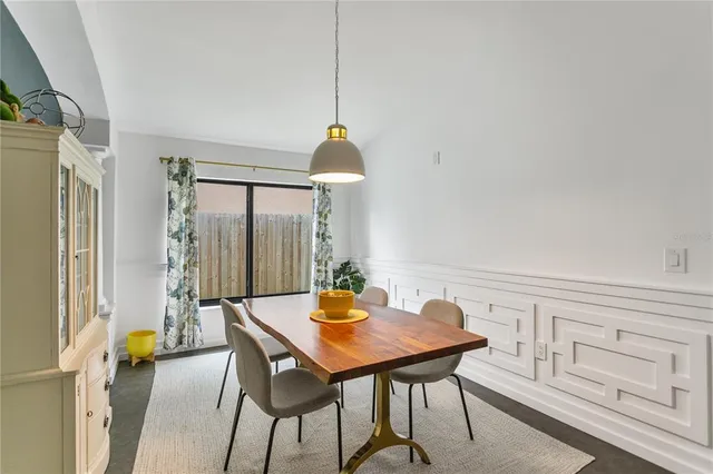 a view of a dining table and chairs in the room