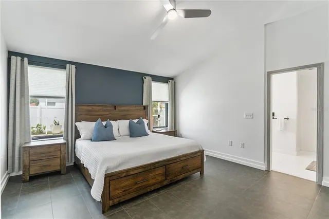 a bedroom with a bed and window