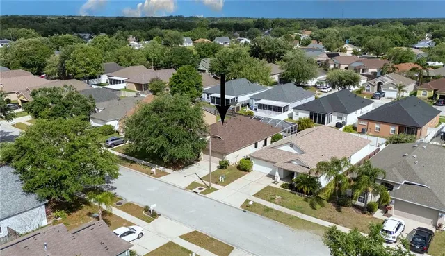 an aerial view of residential houses with outdoor space